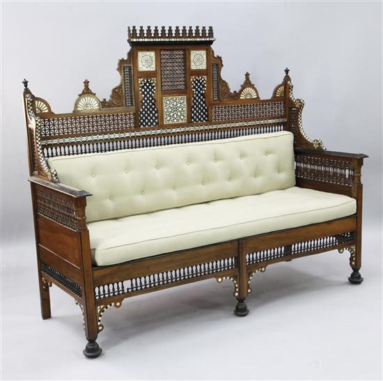 A North African mother of pearl ebony and bone inset hardwood settee, W.5ft 8in. H.4ft 8in.